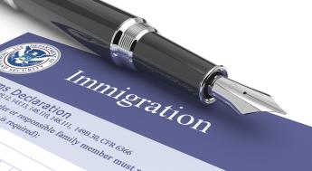 Immigration customs document and ink pen
