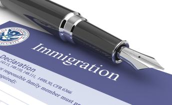 Immigration customs document and ink pen